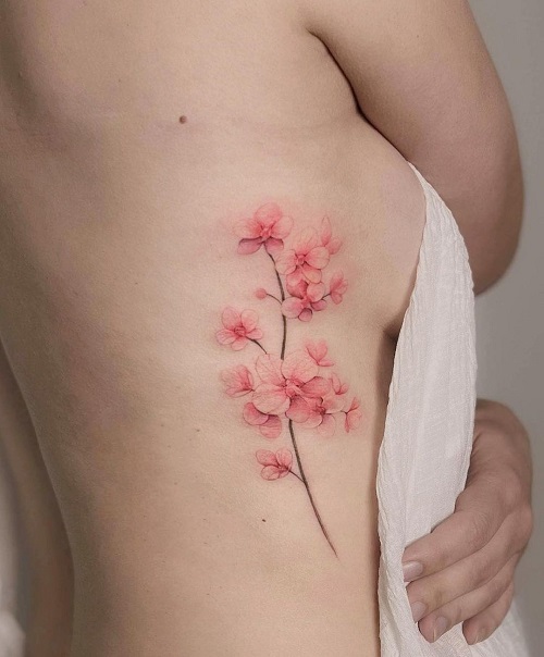 Delicate Flowers in watercolour tattoos idea