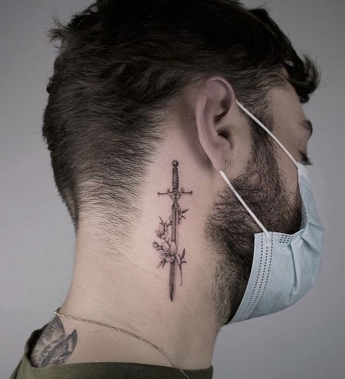 sword with flowers depicting personality tattoo idea