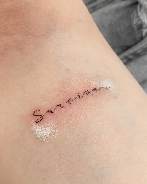 fine line cursive tattoo
