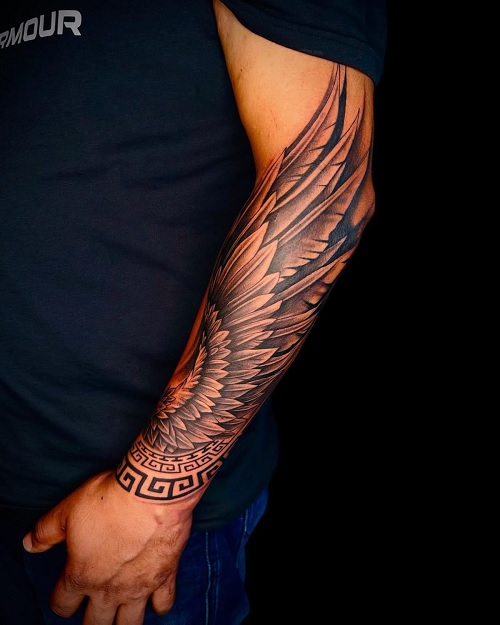 prominent wing design on forearm