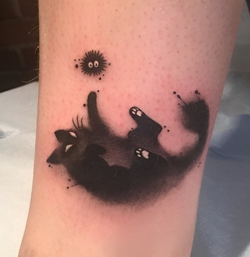 cat playing tattoo