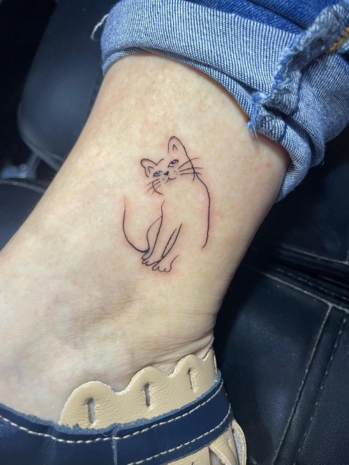 Inspiring linework cat tattoo 1