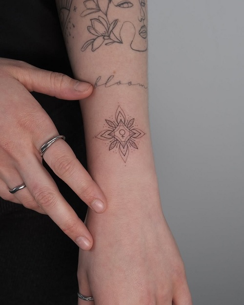 small floral and line tattoo