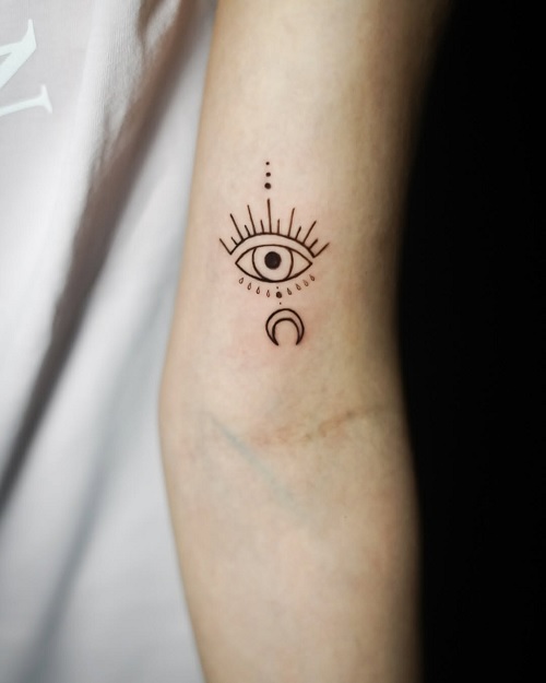 eye and moon tattoo