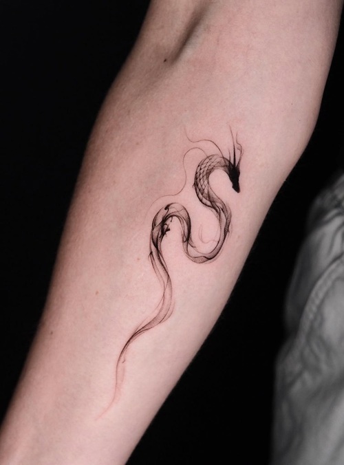 Abstract dragon linework tattoo