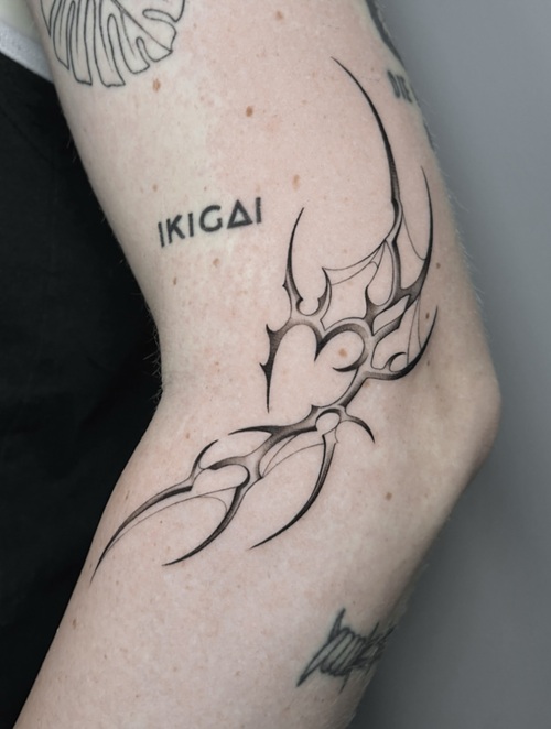 Futuristic folk tattoo with intricate linework