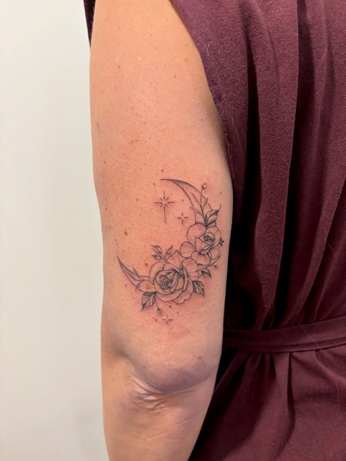 Floral crescent tattoo