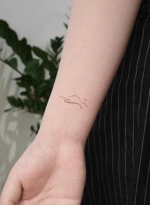 Tiny earthy tattoo