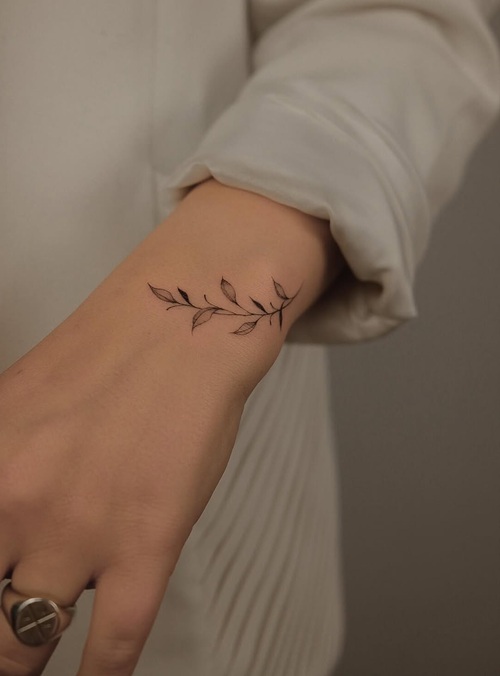 Tiny earthy tattoo