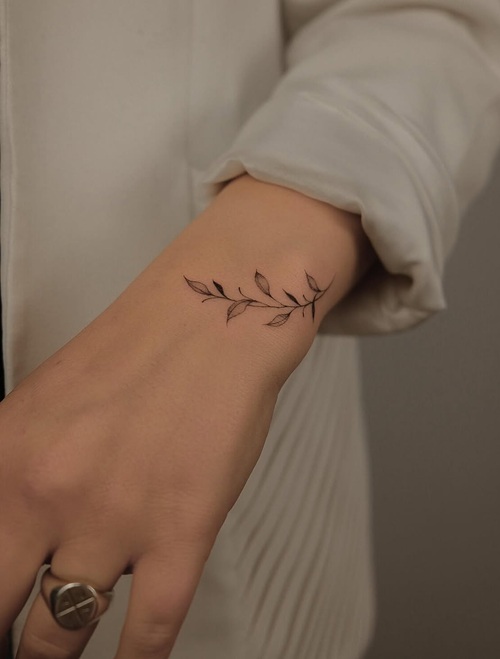 Fine line wrist tattoo