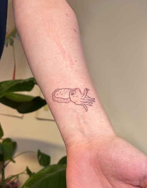 Tiny ocean animal tattoo